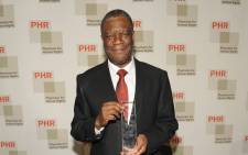 Founder of Panzi Hospital, Dr. Denis Mukwege is posing with his award for fearless advocacy to end the terror of rape in conflict and his devotion to caring for survivors in the Democratic Republic of the Congo as he attends the 2015 Physicians For Human Rights Gala at Jazz at Lincoln Centers Frederick P. Picture: AFP.