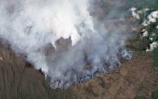This hand out satellite image courtesy of Planet Lab, Inc taken on 12 October 2020, shows a fire on the slopes of Africa’s highest mountain Kilimanjaro. Picture: AFP.
