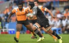 FILE: The Crusaders' Jordan Taufua runs with the ball past The Toyota Cheetahs' Ox Nche (L) during the SUPERXV rugby union match between The Cheetahs and The Crusaders at the Bloemfontein rugby stadium in Bloemfontein on 29 April 2017. Picture: AFP.