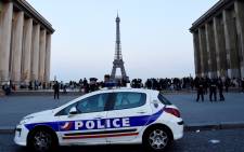 FILE: Policemen stand near a vehicle on the Place du Trocadero in Paris. Picture: AFP