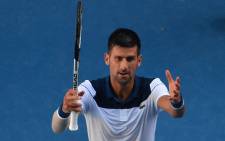 Serbia's Novak Djokovic celebrates beating France's Gael Monfils in their men's singles second round match on day four of the Australian Open tennis tournament in Melbourne on 18 January 2018. Picture: AFP