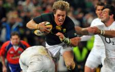 Jean de Villiers tries to score a try and avoids a tacke by England’s Mike Brown during the 1st match between South Africa and England at Kings Park Stadium on 9 June. Picture: AFP.