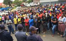 Samwu-affiliated workers gather outside the Ugu District Municipality offices demanding that the mayor addresses them on 30 January 2020. Picture: Nkosikhona Duma/EWN