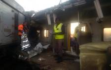 Authorities inspect the inside of a Metrorail train after a train crash in Elandsfontein. Picture: Twitter/@EWNTraffic
