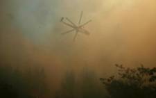 FILE: Summer wildfires, though common for the season, heaped additional misery on the government of Prime Minister Alexis Tsipras, which is struggling to obtain a new bailout from foreign creditors.