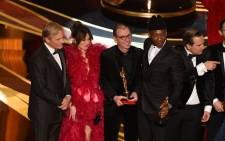 Cast members of 'Green Book' with US actor Viggo Mortensen (L), Linda Cardellini (2nd L) and US actor Mahershala Ali (R) celebrate the Best Picture award onstage during the 91st Annual Academy Awards at the Dolby Theatre in Hollywood, California on 24 February 2019. Picture: AFP