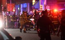 Police officers and firefighters respond to an explosion on 17 September 2016 at 23rd Street between 6th and 7th Avenues in the Chelsea neighborhood of New York City. Picture: Getty Images/AFP. 