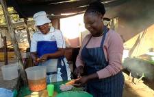 Church members volunteer at a soup kitchen to feed Wonderkop residents in Marikana on 16 May 2014. Picture: Vumani Mkhize/EWN