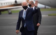 Democratic presidential nominee former US Vice President Joe Biden waves as he disembarks from an airplane at New Castle Airport in New Castle, Delaware,  31 August 2020, following travel to Pennsylvania for campaign events. Picture: AFP.
