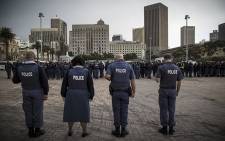 Saps officers pray before an operation in Cape Town's CBD on 21 April. Picture: Thomas Holder/EWN