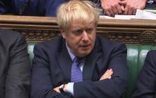 A video grab from footage broadcast by the UK Parliament's Parliamentary Recording Unit (PRU) shows Britain's Prime Minister Boris Johnson reacting during the debate on the Brexit withdrawal agreement bill in the House of Commons in London on 22 October 2019. Picture: AFP