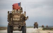 A US military convoy drives on the outskirts of the Kurdish-controlled northern Syrian city of Qamishli on 9 January 2020. Picture: AFP