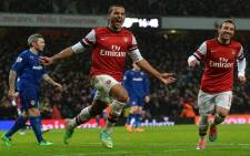 Arsenal'sFILE: Theo Walcott celebrates scoring their second goal during the English Premier League football match between Arsenal and Cardiff City. Picture: AFP.