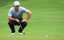 Rory McIlroy of Northern Ireland lines up a putt for eagle on the 18th green during the second round of the 96th PGA Championship at Valhalla Golf Club on 8 August 2014. Picture: AFP.