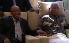 Former President Nelson Mandela receives a symbolic flame from ANC Chairperson Baleka Mbete on 30 May 2012. It was his first appearance in public since being hospitalised in January. Picture: ANC