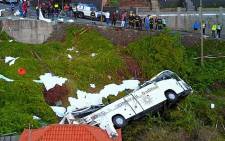 A video grab obtained from drone footage shows the wreckage of a tourist bus that crashed on 17 April 2019 in Canico, on the Portuguese island of Madeira. Picture: AFP