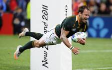 Francois Hougaard scores a try during the game against Namibia in Auckland on 22 September 2011. Picture: AFP