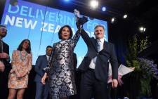 Leader of the National Party Bill English (R) and his wife Mary (L) react onstage at the party's election event at SkyCity Convention Centre in Auckland on 23 September 2017. New Zealanders went to the polls on 23 September to elect a new parliament. Picture: AFP.