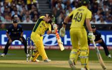 Australia's batsman David Warner (L) plays a shot during the 2015 Cricket World Cup final between Australia and New Zealand in Melbourne on March 29, 2015.  Picture: AFP