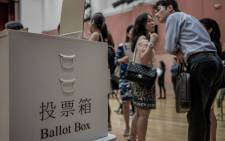 A ballot box is seen displayed at a mock polling station set up to help electors familiarise themselves with voting procedures in Hong Kong on September 6, 2012. Hong Kong goes to the polls Sunday to elect a new legislature that will lay the ground rules for direct elections, amid growing disquiet over mainland China's hold over the former British colony. Picture: AFP.