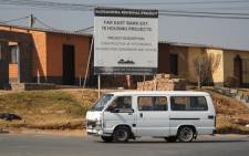 FILE: A taxi drives past a housing development under the Alexandra Renewal Project. Picture: EWN