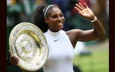 In this file photo taken on 9 July 2016 US player Serena Williams poses with the winner's trophy, the Venus Rosewater Dish, after her women's singles final victory over Germany's Angelique Kerber on the thirteenth day of the 2016 Wimbledon Championships at The All England Lawn Tennis Club in Wimbledon, southwest London. Picture: AFP
