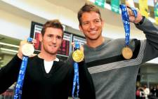 Cameron van der Burgh and Gerhard Zandberg at OR Tambo airport, 5 August 2009 after returning back from the FINA World Championships in Rome. Picture: Neil McCartney/SAPA