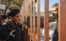 MMC Mpho Phalatse confronts the landlord of an illegal pre-school where two children died. Picture: Kayleen Morgan/EWN