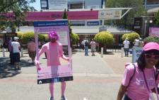 People dressed in pink shirts, caps and even costumes, making their way to the ground. Picture: Morena Mothupi/EWN