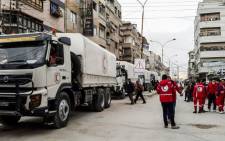 The Syrian Red Crescent and the United Nations deliver an aid convoy to Al-Nishabieh in Rural Damascus, Syria. The convoy carried relief items of food parcels, flour, nutrition, medicines and medical materials for 1,440 families there. Picture: Twitter/ @SYRedCrescent