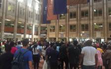 Wits University students have gathered at Senate House, singing and chanting ahead of a mass meeting this afternoon. Picture: Thando Kubheka/EWN.