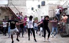 A screengrab via JAWS shows Palestinians taking part in the Jerusalema dance challenge.