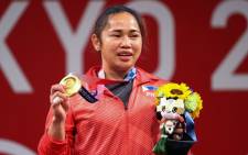 Weightlifter Hidilyn Diaz made history on Monday when she became the first athlete from the Philippines to win an Olympic gold medal. Picture: @Olympics/Twitter.