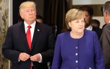 FILE: US President Donald Trump and German Chancellor Angela Merkel arrive for a bilateral meeting on the eve of the G20 summit in Hamburg, northern Germany, on 6 July 2017. Picture: AFP