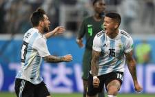 Argentina's defender Marcos Rojo (R) celebrates his goal with Argentina's forward Lionel Messi during the Russia 2018 World Cup Group D football match between Nigeria and Argentina at the Saint Petersburg Stadium in Saint Petersburg on 26 June, 2018. Picture: AFP.