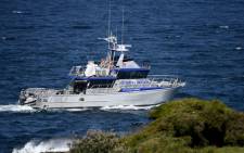 A fisheries boat patrols near the fatal shark attack site on Little Bay in Sydney on 17 February 2022, as Sydney authorities deployed baited lines to try to catch a giant great white shark that devoured an ocean swimmer, the city's first such attack in decades. Picture: Muhammad FAROOQ/AFP