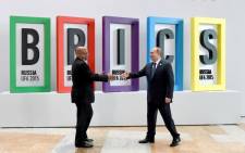 South African President Jacob Zuma is greeted by Russian President Vladimir Putin as he arrives at the venue for the Brics VII Summit. Picture: Dirco.