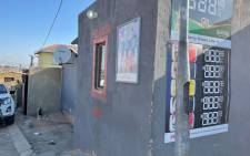 Police have removed the tape they used to cordon off the Emazulwini tavern which is also known as “KwaMdlalose” where at least 15 people were killed earlier on Sunday, 10 July 2021. Police are probing cases of murder and attempted murder after 23 people in total were shot. Picture: Masechaba Sefularo/EWN.