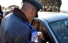 A motorist’s cellphone impounded on the Nelson Mandela Boulevard on 5 July 2012. Picture: Aletta Gardner/EWN