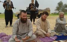 FILE: Swede Johan Gustafsson (L), South African-Briton Stephen Malcom (C) and Dutch national Sjaak Rijke (R) held captive by al-Qaeda. Picture: AFP