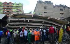Rescue workers attend to the scene of a six-storey building that collapsed in Nairobi, on 6 December 2019. Picture: AFP