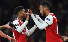 FILE: Arsenal's Gabonese striker Pierre-Emerick Aubameyang (R) comes on for Arsenal's English midfielder Reiss Nelson (L) during the UEFA Europa League Group F football match between Arsenal and Standard Liege at the Arsenal Stadium in London on 3 October 2019. Picture: AFP.
