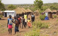 FILE: Refugee children from South Sudan walk in Bidibidi resettlement camp in the Northern District of Yumbe on 14 April, 2017. Picture: AFP.