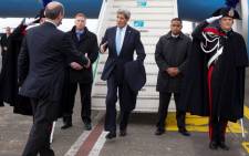 FILE: US Secretary of State John Kerry (C) arrives at Ciampino International Airport, on 14 December, 2014, in Rome. Picture: AFP.