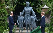 Britain's Prince William, Duke of Cambridge (L) and Britain's Prince Harry, Duke of Sussex unveil a statue of their mother, Princess Diana at The Sunken Garden in Kensington Palace, London on 1 July 2021, which would have been her 60th birthday. Picture: Dominic Lipinski/POOL/AFP