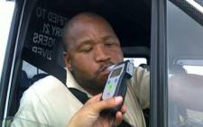 A Western Cape motorist performs a breathalyzer test as part of a crackdown on road safety in September 2010. Picture: Chantall Presence/Eyewitness News