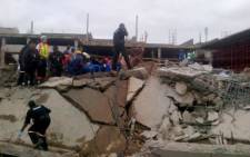 FILE: Emergency and construction workers search among the rubble at the site of a collapsed mall in Tongaat, KwaZulu-Natal, on 19 November 2013. Picture: Twitter via @Mariolungelo.