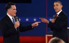Barack Obama and Mitt Romney battle during the 2nd presidential debate in New York. Picture: AFP/Saul Loeb