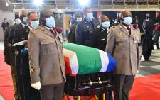 Members of the military carry in the coffiin of late ANC veteran Andrew Mlangeni at the UJ Soweto Campus on 29 July 2020. Mlangeni has been accorded a Special Official Funeral Category 1 with military honours. Picture: @GCISMedia/Twitter