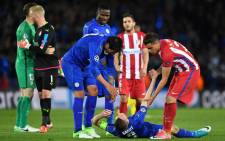 Leicester City striker Leonardo Ulloa (C) and Atletico Madrid defender Jose Maria Gimenez (R) help a dejected Leicester City's striker Jamie Vardy up following the UEFA Champions League quarterfinal tie between the two sides. Picture: AFP